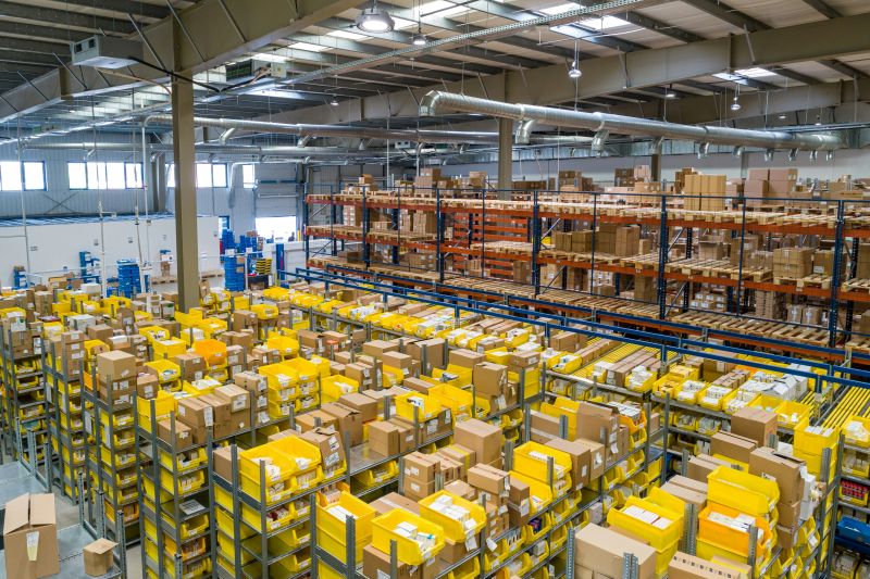 Warehouse interior of an organization asking, "does my business need a warehouse management system?".